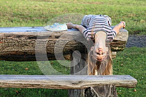 Girl lying on wooden table