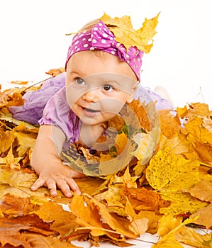 Girl lying on yellow leaves