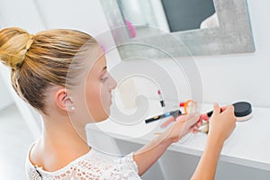 Girl with make-up products photo