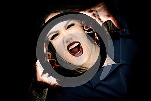 Girl with make-up ring lamp, gruesome appalling portrait photo