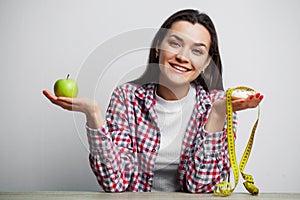 Girl makes a choice between healthy and harmful food