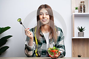 Girl makes a choice between healthy and harmful food