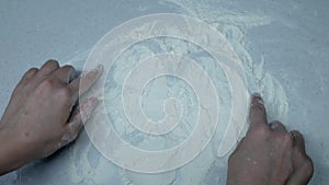 Girl makes a heart from flour