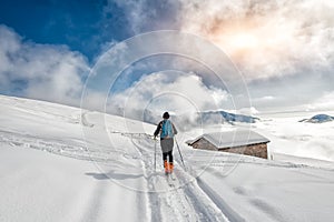 girl makes ski mountaineering