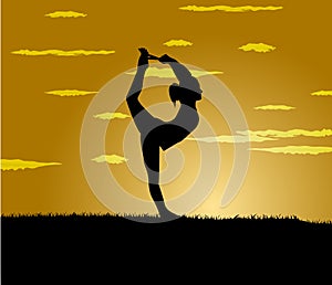 Girl makes yoga exercise at the gloaming