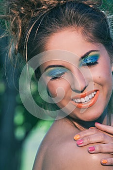 Girl with makeup and handmade bracelets