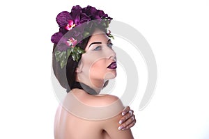Girl with makeup in purple orchids