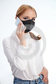 Girl making call wearing face mask