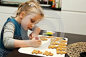 Girl making gingerbread cookies for Christmas