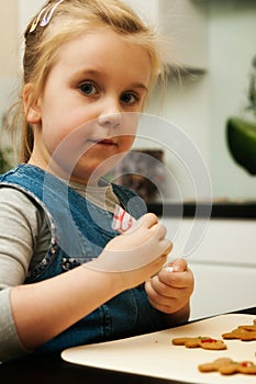 Girl making gingerbread cookies for Christmas