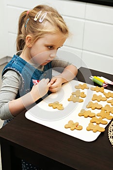 Girl making gingerbread cookies for Christmas