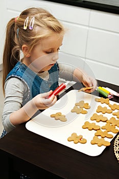 Girl making gingerbread cookies for Christmas