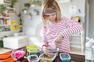 Girl making homemade slime toy