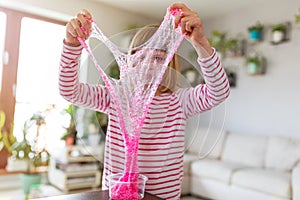 Girl making homemade slime toy