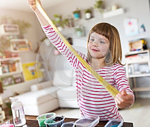 Girl making homemade slime toy