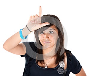 Girl Making the Loser Sign on her Forehead photo