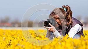 Girl making pictures of flowers