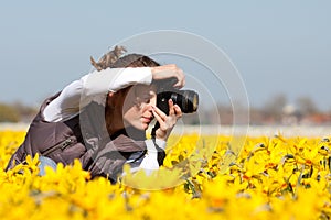 Girl making pictures of flowers