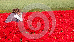 Girl making pictures of flowers