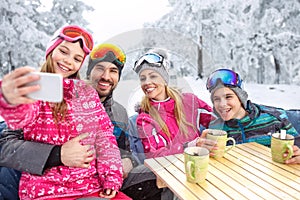 Girl making selfie together with smiling family