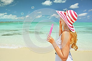 Girl making soap bubbles