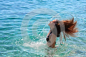 Girl making water splash