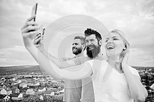 Girl and man with mobile smartphones communication online. Selfie time. Life online. People taking selfie or streaming