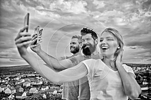 Girl and man with mobile smartphones communication online. Selfie time. Life online. People taking selfie or streaming