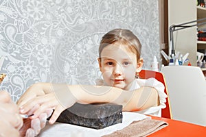 Girl at manicurist parlor