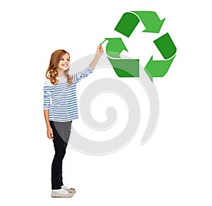 Girl with marker pointing to green recycle symbol