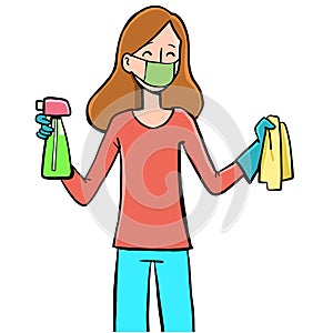 Girl with a mask that cheerfully cleans the house with disinfectants and a cloth photo