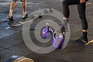 Girl with mask in a gym doing Cross training