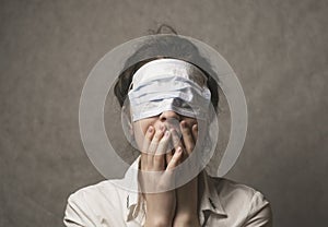 A girl with a mask to protect her from the coronavirus. The mask on the girl`s face. Mask on the eyes