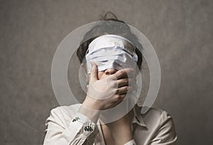 A girl with a mask to protect her from the coronavirus. The mask on the girl`s face. Mask on the eyes