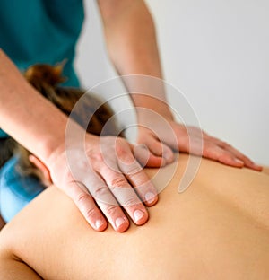 Girl during massage in spa salon