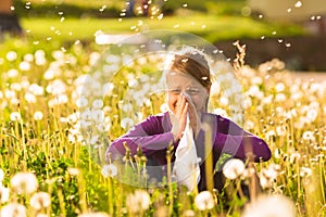 Girl in meadow and has hay fever or allergy photo