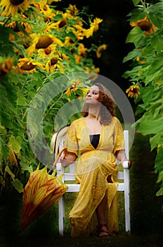 Girl in a meadow of sunflowers