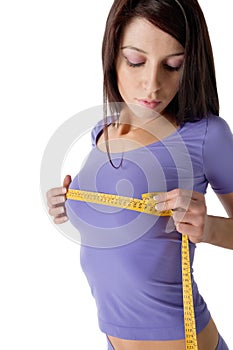 Girl measuring her perfect breast