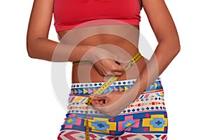Girl measuring her waist with soft meter isolated