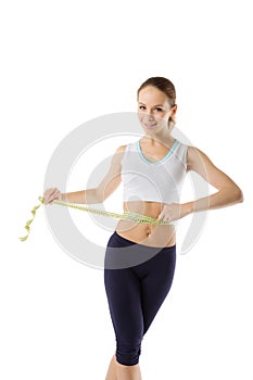 Girl measuring waist