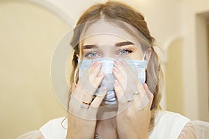 Girl in a medical mask close-up