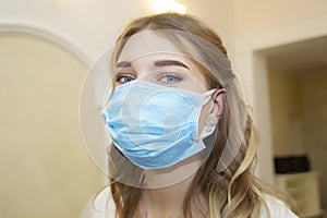 Girl in a medical mask close-up