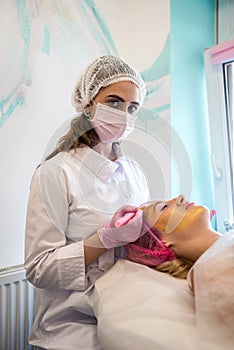 girl in a medical spa came for chemical peeling of the body and cosmetic treatment of acne.