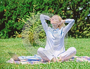 Girl meditate on rug green grass meadow nature background. Woman relaxing practicing meditation. Every day meditation