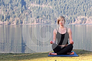 Girl meditating by Cultus lake British Columbia