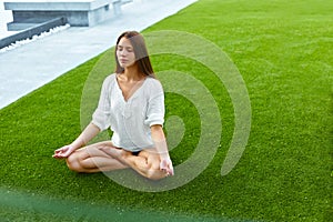 Girl meditating in lotus posture. Yoga