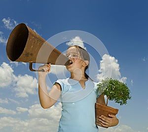 Girl with megaphone and small tree