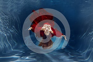 Girl mermaid. Underwater scene. A woman, a fashion model in the