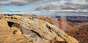 Girl at Mesa Arch in Canyonlands National Park