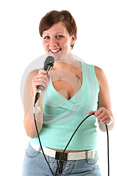 Girl with a microphone leading a show or singing